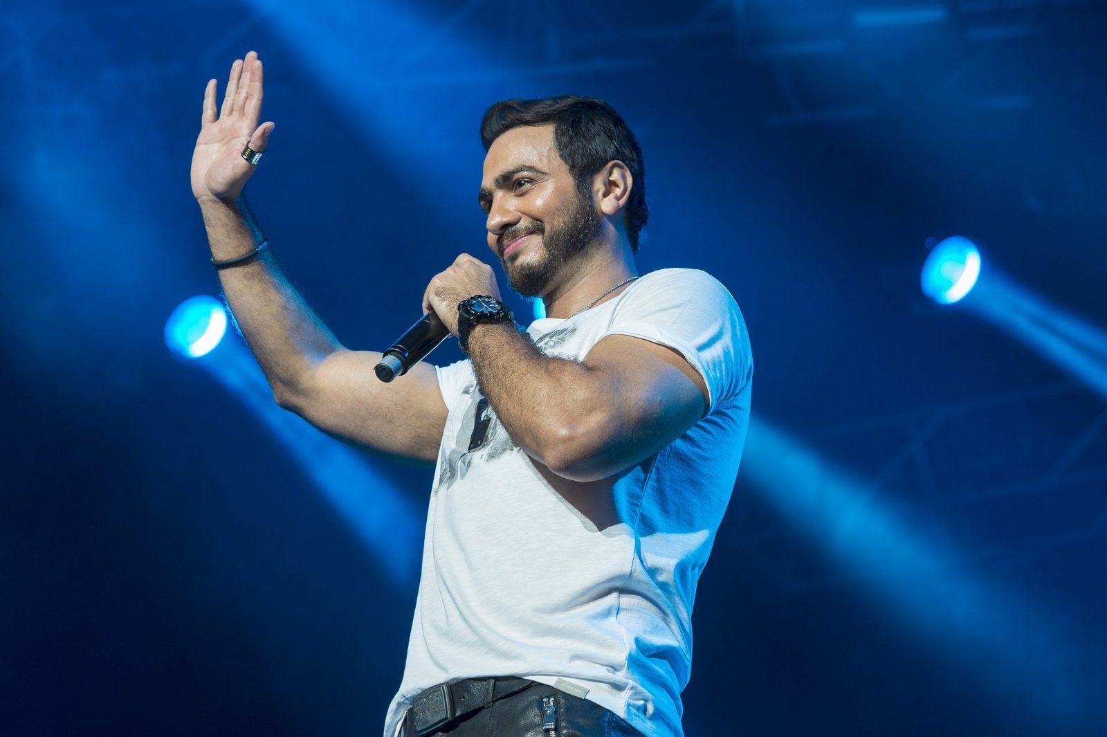 Tamer Hosny singing on stage