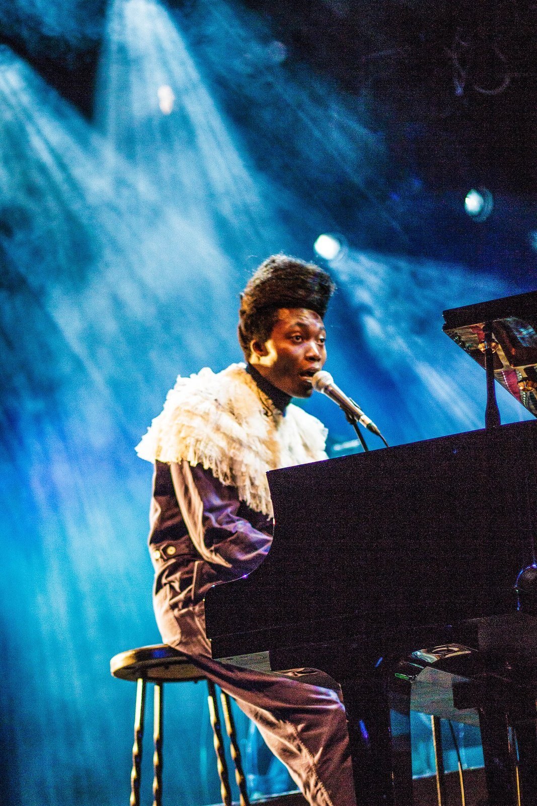 Benjamin Clementine performing on stage